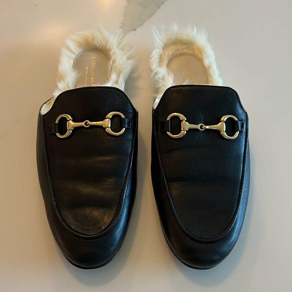Black leather, fur lined mules
